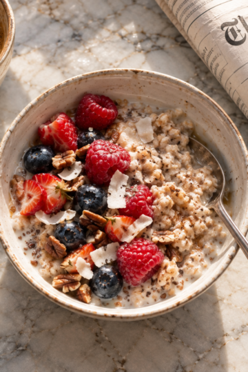 power coconut oatmeal breakfast with pecan and fresh fruit