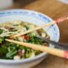 Bowl of mushroom ramen with noodles, pak choi, mushrooms and spring onions"
