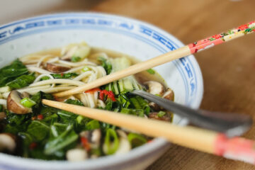 Bowl of mushroom ramen with noodles, pak choi, mushrooms and spring onions"